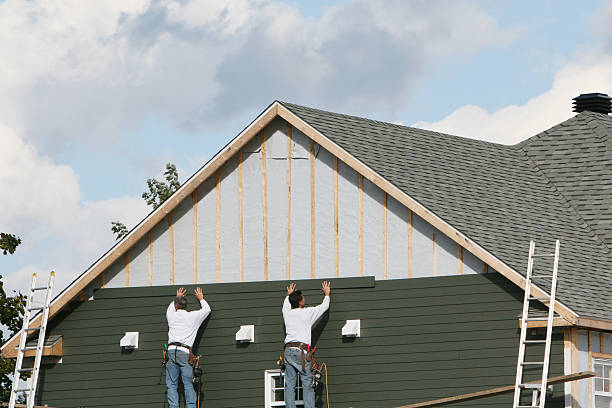 Professional Storm Damage Siding Repair technician working in Barberton, WA